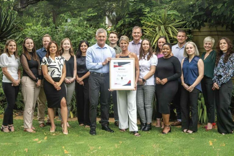 The Crue Invest team with the award.