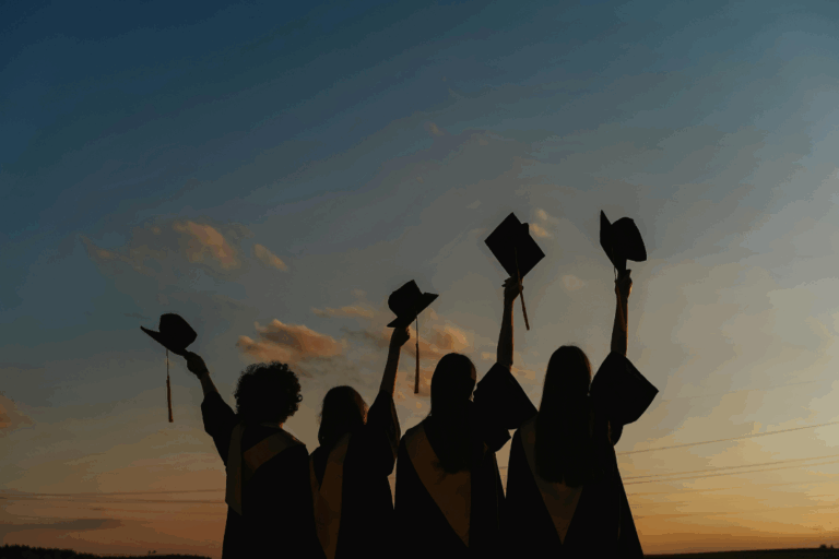 A group of graduates with their caps raised