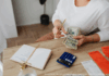 Photo by Photo By: Kaboompics.com: https://www.pexels.com/photo/woman-counting-money-at-the-desk-5900185/