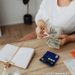 Photo by Photo By: Kaboompics.com: https://www.pexels.com/photo/woman-counting-money-at-the-desk-5900185/