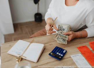Photo by Photo By: Kaboompics.com: https://www.pexels.com/photo/woman-counting-money-at-the-desk-5900185/